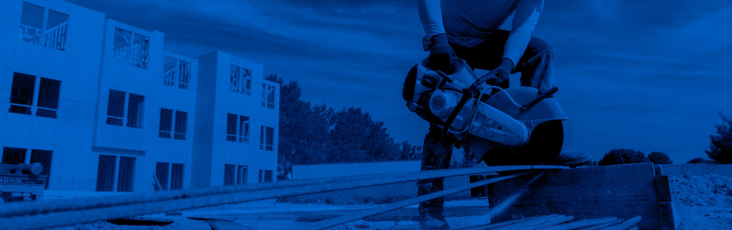 Construction worker cutting metal